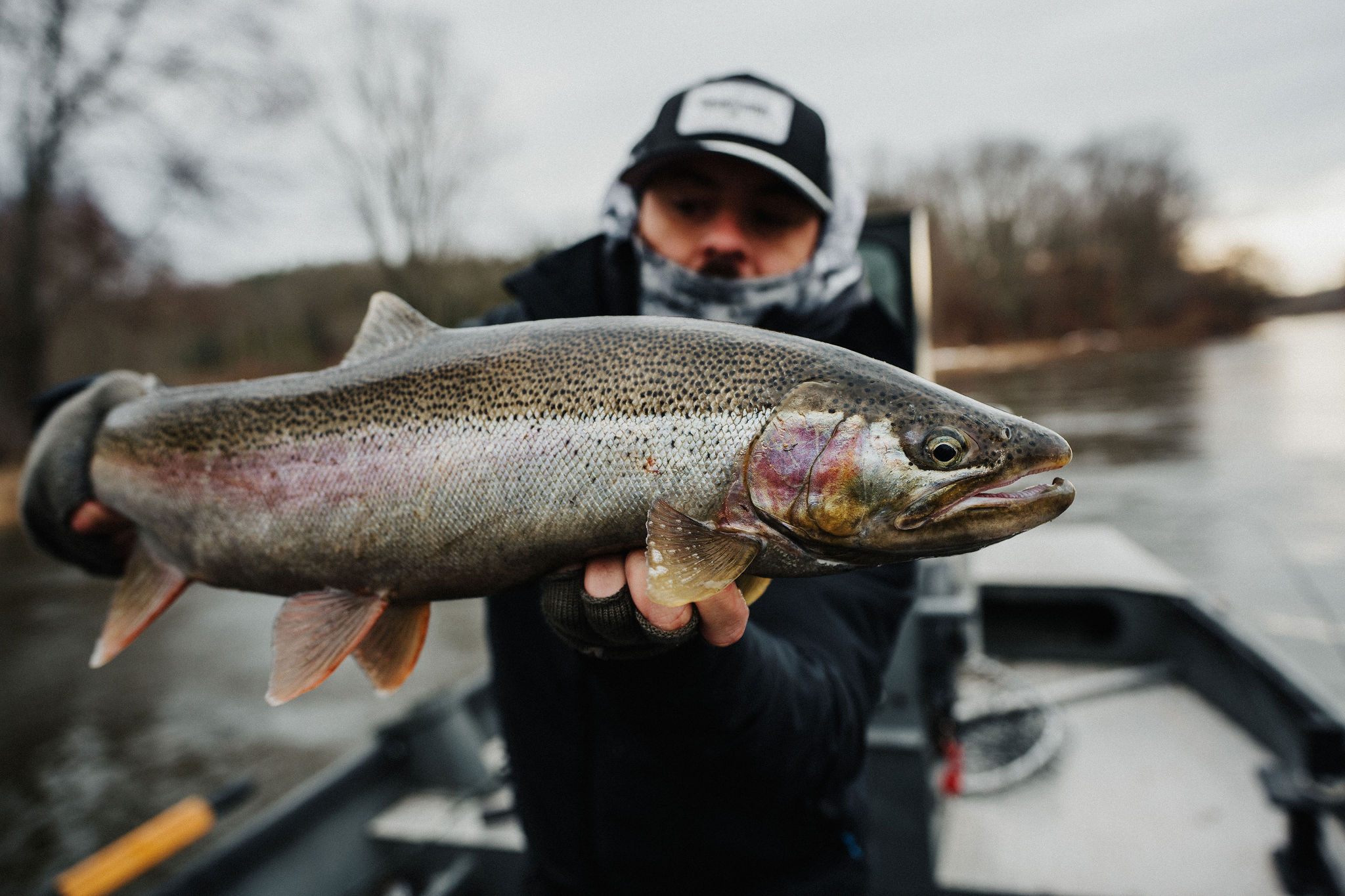 Angler with a rainbow trout on a Pacific Northwest river