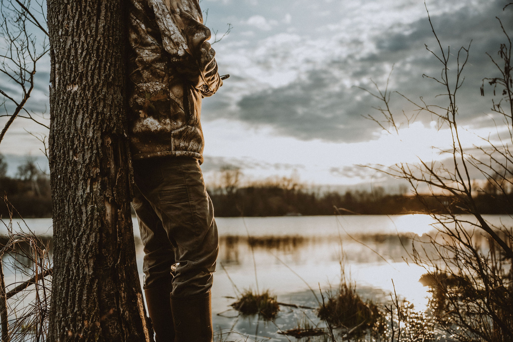 Hunter at the edge of a Pacific Northwest lake